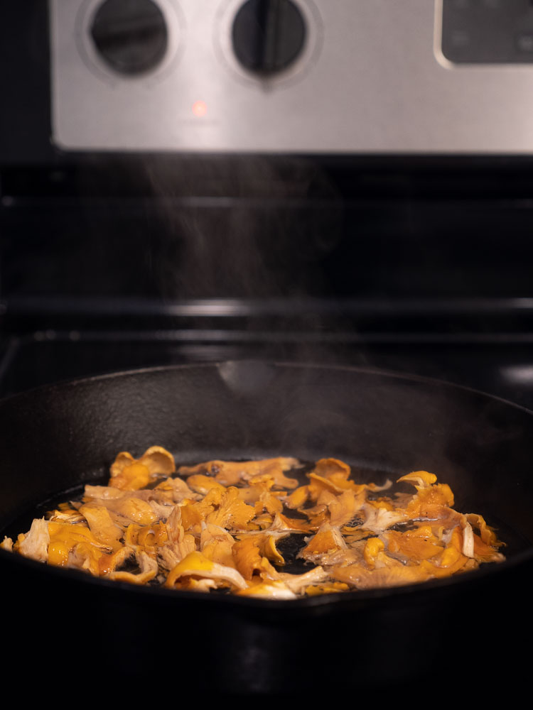 Steam rising off of cooking chanterelles