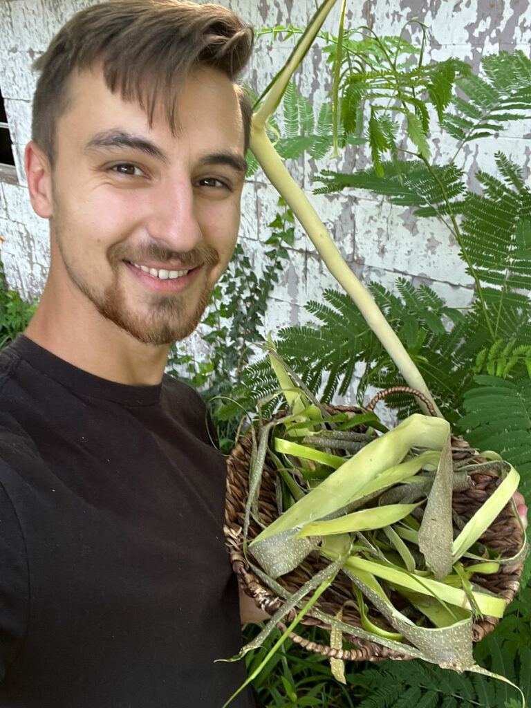 Jesse Holding Harvested Albizia Bark