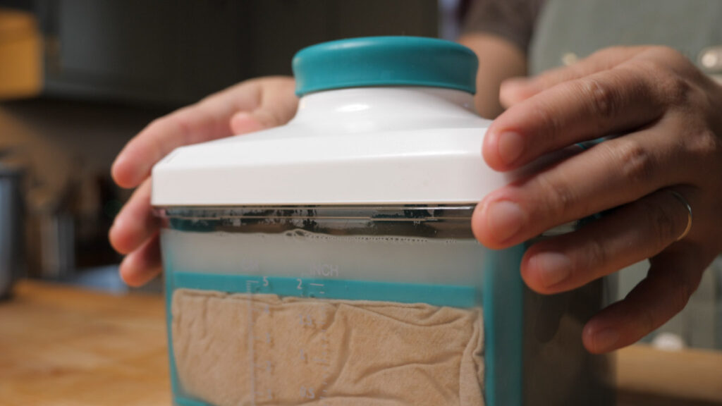 Liquid Being Pressed From Black Walnut Tofu